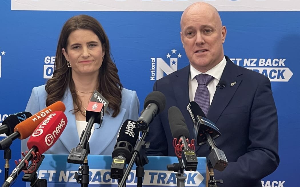 Leader of National Party Christopher Luxon and NP finance spokesperson Nicola Willis unveiling a global taxation plan in a press conference. Photo: by Katie Scotcher / RNZ
